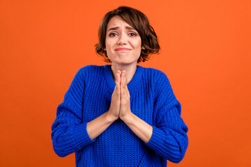 Poster - Portrait of attractive girlish girl begging you favor waiting dream isolated over bright orange color background