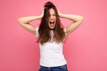 Wall Mural - Photo shot of cute nice charming gorgeous attractive pretty youngster woman with beautiful brunette hair wearing white t-shirt for mockup isolated over colorful background with copy space and