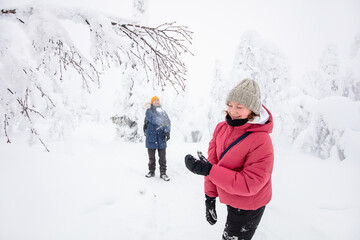 Wall Mural - Family outdoors in winter forest