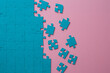 © Alexander - A set of puzzles, the process of collecting in a large pattern. Teamwork and problem solving, concept. Blue mosaic on pink