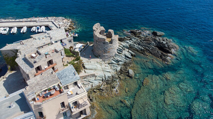 Wall Mural - Aerial view of Erbalunga, a small fishing village on the Corsican Cape, France - Ruins of a Genoese Tower at the tip of a rocky cape in the Mediterranean Sea