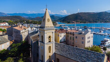 Aerial View Of The Church Of Saint Florent, A Coastal Town On The Cap Corse In Upper Corsica, France