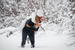 © Andrii - Couple playing with snow in the forest