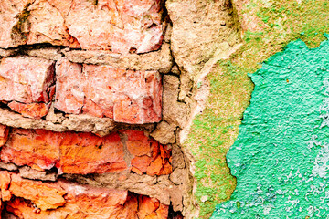 Texture of a brick wall with cracks and scratches which can be used as a background