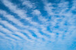 Interesting wavy lines of clouds probably cirrocumulus on a summer day.