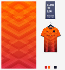 Soccer jersey pattern design. Geometric pattern on orange background for soccer kit, football kit or sports uniform. T-shirt mockup template. Fabric pattern. Abstract background. 