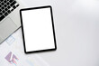 © chinnarach - close up top view on spreadsheet business's data and empty screen dashboard on tablet with clipping path for data management of business financial and economy