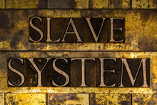 Slave System Text On Textured Grunge Copper And Vintage Gold Background