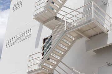 Wall Mural - fire escape stair steel. white outdoor metal stair of building.