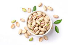 Flat Lay Of Pistachio Nuts In White Bowl Isolated On A White Background.