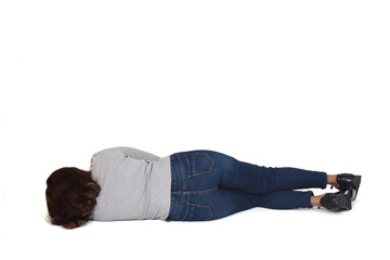 Wall Mural - rear view of a woman lying on the floor on white background