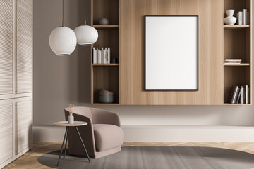 Empty framed canvas near an armchair in a beige living room