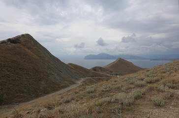 Sticker - hilly landscape by the sea