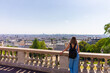 Tourist contemplating Paris from Montmartre