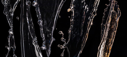 Wall Mural - an assortment of several sparkling transparent iridescent water splashes isolated on a black background. big set of frozen splash.