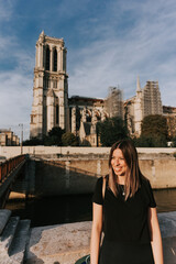 Tourist in front of Notre Dame cathedral in Paris