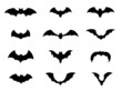 Vector set with black flying bats silhouettes.