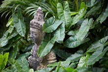 Ancient Buddha Statue, Closeup. In A Quiet And Comfortable Natural Environment 
