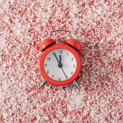 Wall Mural - classic retro alarm clock on a red background