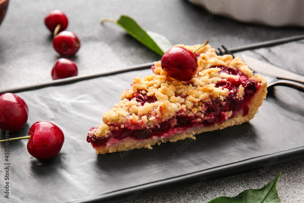 Plate with piece of tasty cherry pie on light background, closeup