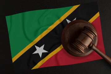 Judges hammer and the flag of Saint Kitts and Nevis. Law and Justice. Constitutional law