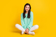 © deagreez - Full body photo of pretty cute nice woman sit floor good mood smile isolated on shine yellow color background