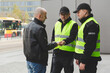 © Photographee.eu - Two police officers talking to man on the street