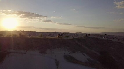 Sticker - An aerial drone shot of a top of a rocky hill at sunset in Capadoccia, Turkey