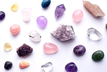Gems Of Different Colors. Amethyst, Rose Quartz, Agate, Apatite, Aventurine, Olivine, Turquoise, Aquamarine, Rhinestone Lie On A White Background