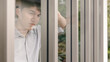 © SHUTTER DIN - young asian businessman looking out of window
