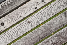 Parallel Lines Of Textured Wooden Slats Of A Park Bench