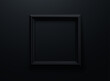 Black picture frame on black wall background