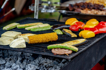 Wall Mural - Vegetables bbq. Slices of vegetables and corn are grilled outdoors. Vegetarian picnic