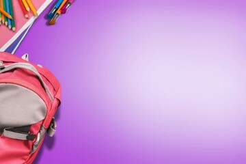 Wall Mural - Backpack with colorful school supplies on the background. Back to school.