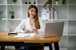 © David - Portrait of smiling beautiful business asian woman with working in modern office desk using computer, Business people employee freelance online marketing e-commerce telemarketing concept.