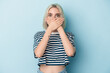 © Asier - Young caucasian woman isolated on blue background shocked covering mouth with hands.
