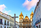 Fototapeta Miasto - Old houses and churches in colonial and baroque style with a crucifix in the central square of the historic Pelourinho district in Salvador, Bahia