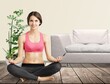 © BillionPhotos.com - The girl does yoga, woman at home practices asanas. Hands on chest, mudra.
