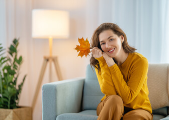 Wall Mural - woman resting on sofa at home