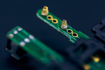 Canvas Print - Macro shot of a green electronic circuit board with its small details