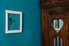 Key In Frame On Blue Wall Backgroung. Key New Home, Homeownership, Keys To The House, Buying Home
