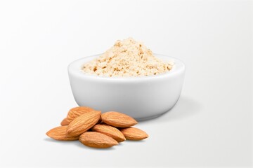 Canvas Print - Almond flour in the bowl and almonds nut on the desk