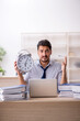 © Elnur - Young male employee in time management concept