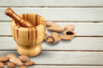 Poster - Almond flour in the bowl and almonds nut on the desk