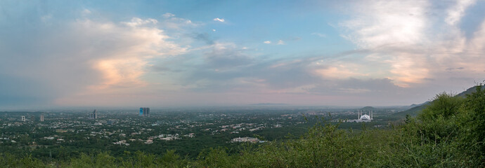 Wall Mural - panoramic aerial view of cloudy sky and islamabad cityscape from daman-e-ko, pakistan
