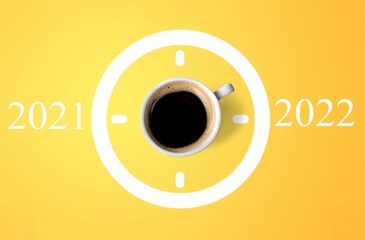 Poster - Happy new year 2022. Cup of coffee change 2021 to 2022 on the background. Start concept