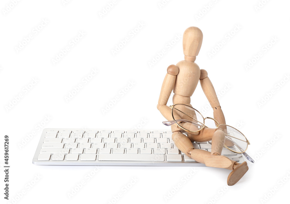 Wooden mannequin with keyboard and glasses on white background