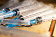Close-up shot of disposal injection syringes - perfect for a vaccination concept