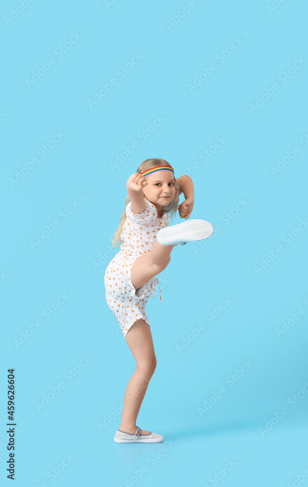 Fighting little girl on color background