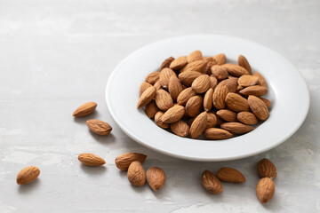 Poster - almond on white small plate on ceramic